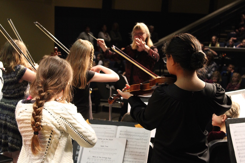 EBLS students playing in an orchestra concert.