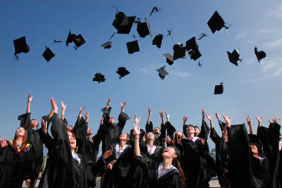 Graduates trowing their cap in the air