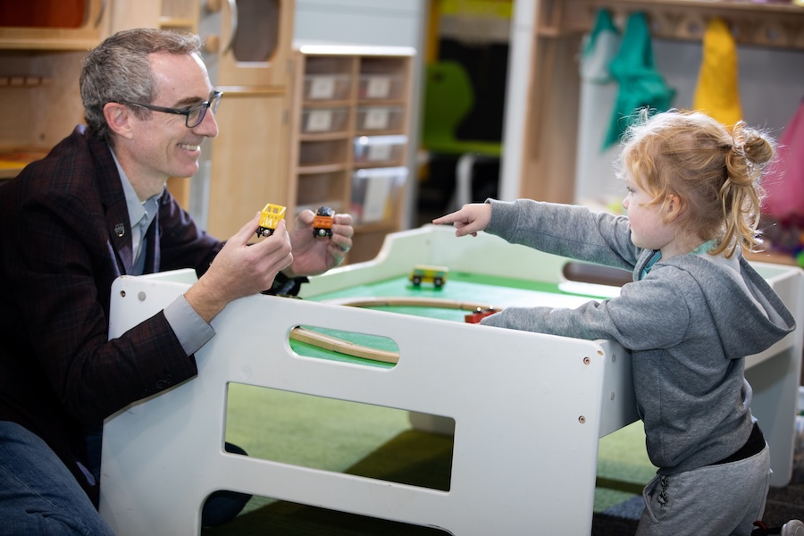 Researcher working with child