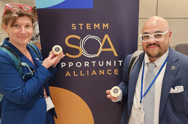 Drs. Tofel-Grehl and Suárez enjoy an official White House cupcake at the STEMM summit.