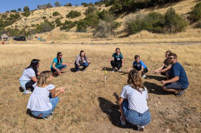 Students having a discussion in a circle. 