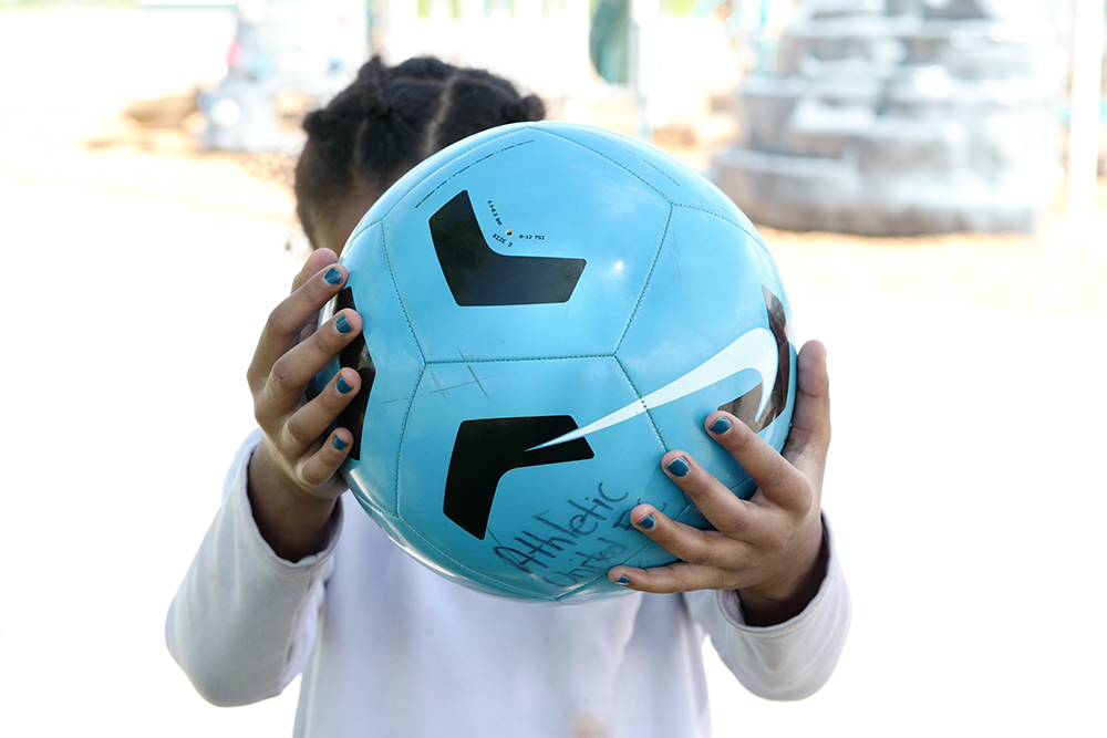 Girl holding a ball