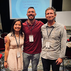 Tyler Renshaw with students at a conference