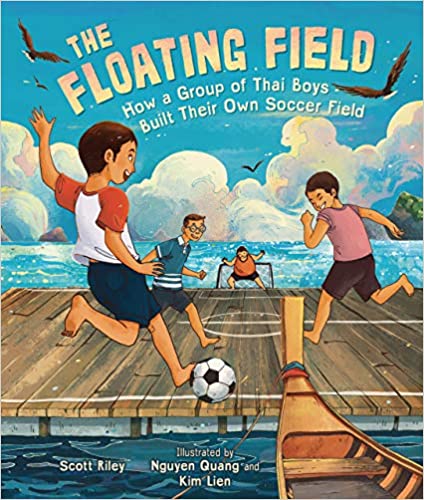 kids playing soccer on a floating platform in the ocean